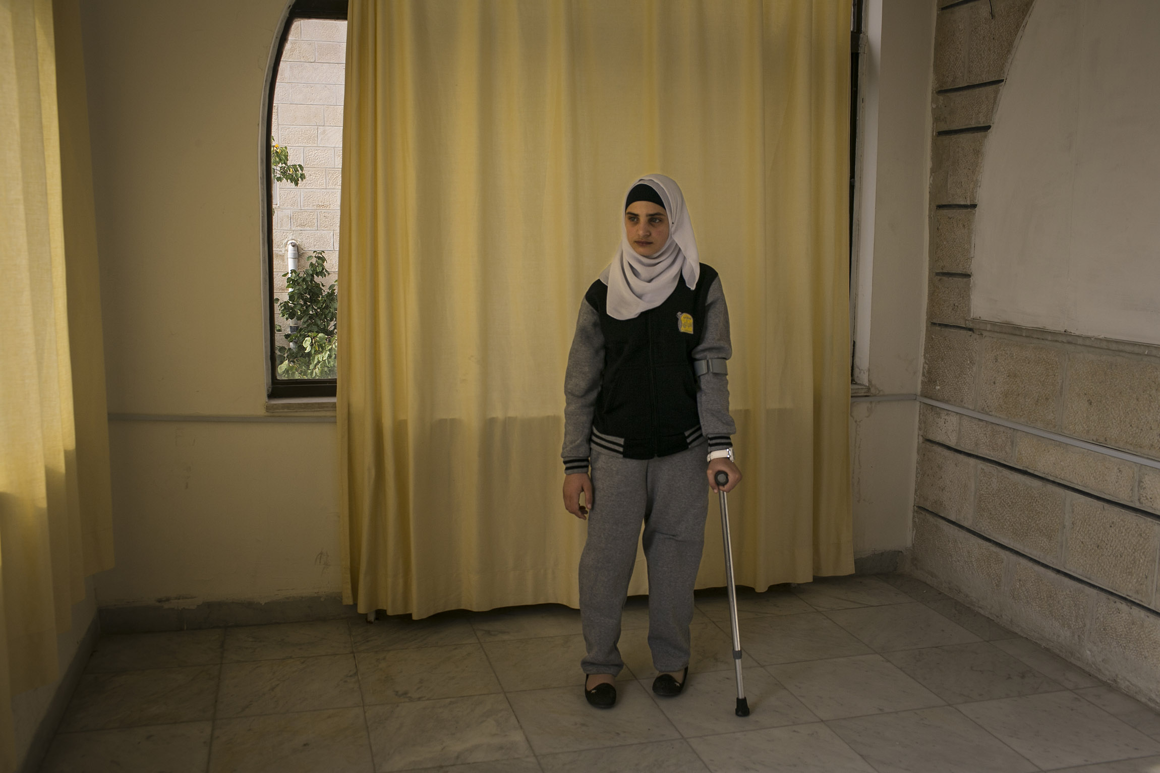 Jordan. Young refugee finds solace in her foster home at a local NGO in Amman. She cries daily for her mother who is still in Syria.
