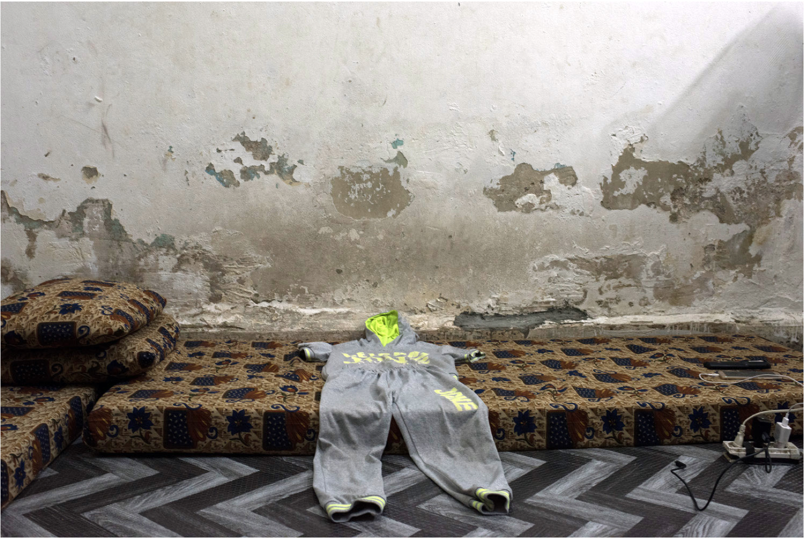 This the only pair of clothes that Ahmad’s parents kept, the track suit that he loved most.